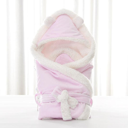 Newborn baby being hugged and swaddled by baby - Almoni Express
